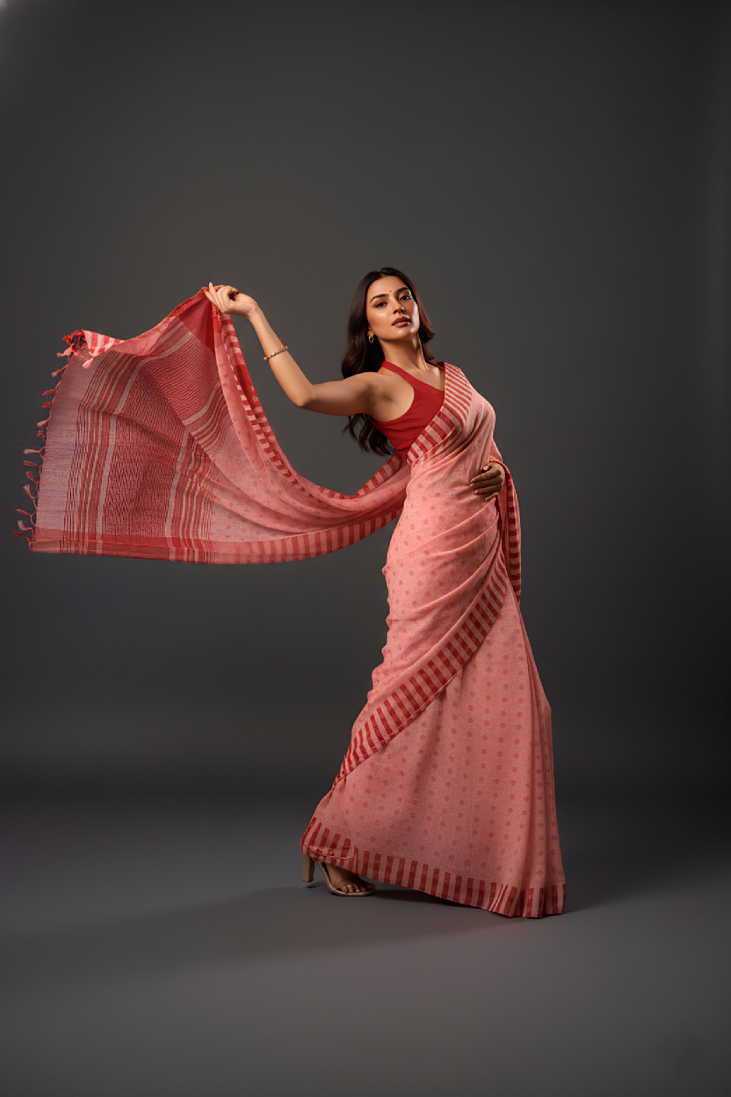Graceful Red Brasso Saree with Floral Prints & Stylish Striped Edges