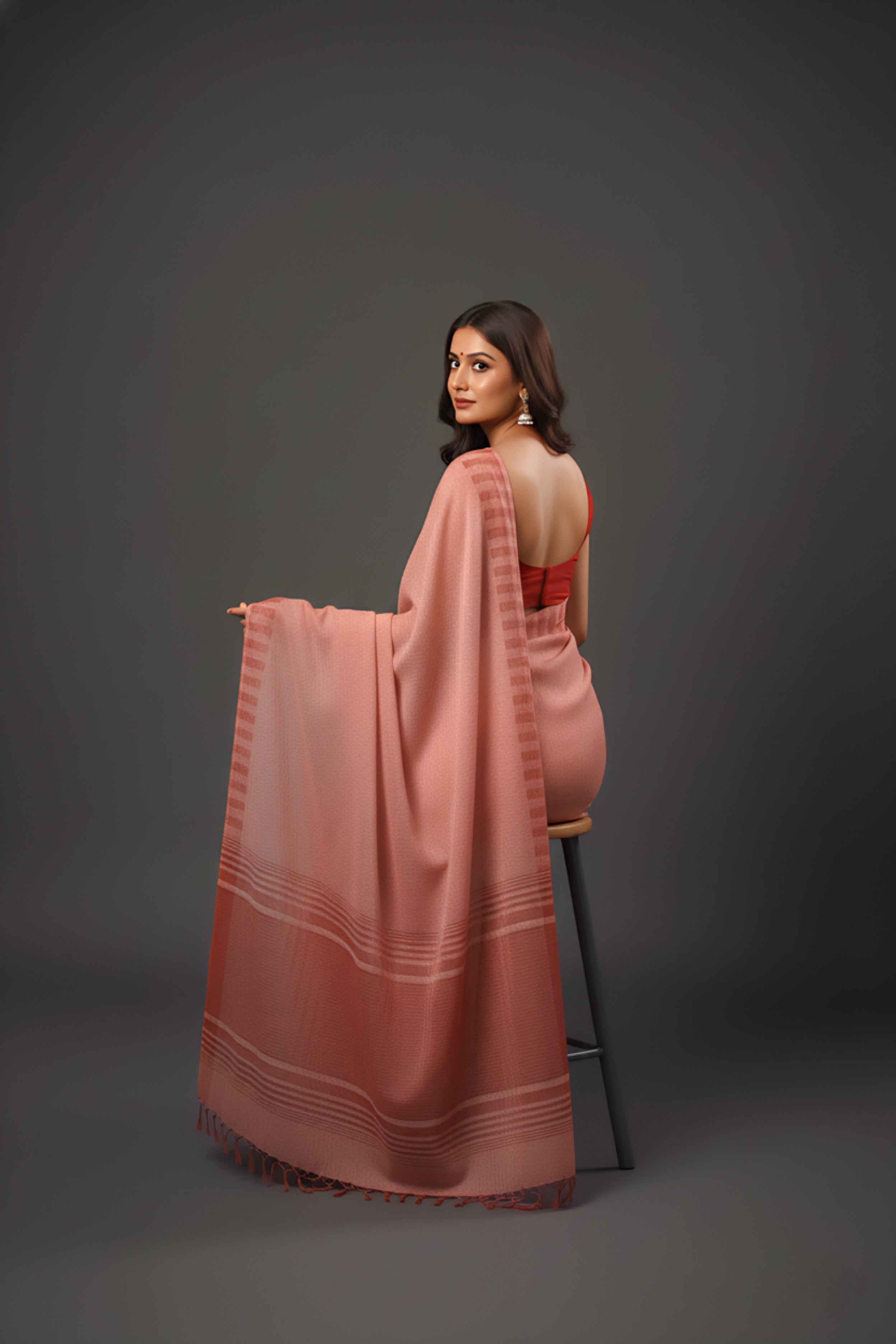 Graceful Red Brasso Saree with Floral Prints & Stylish Striped Edges