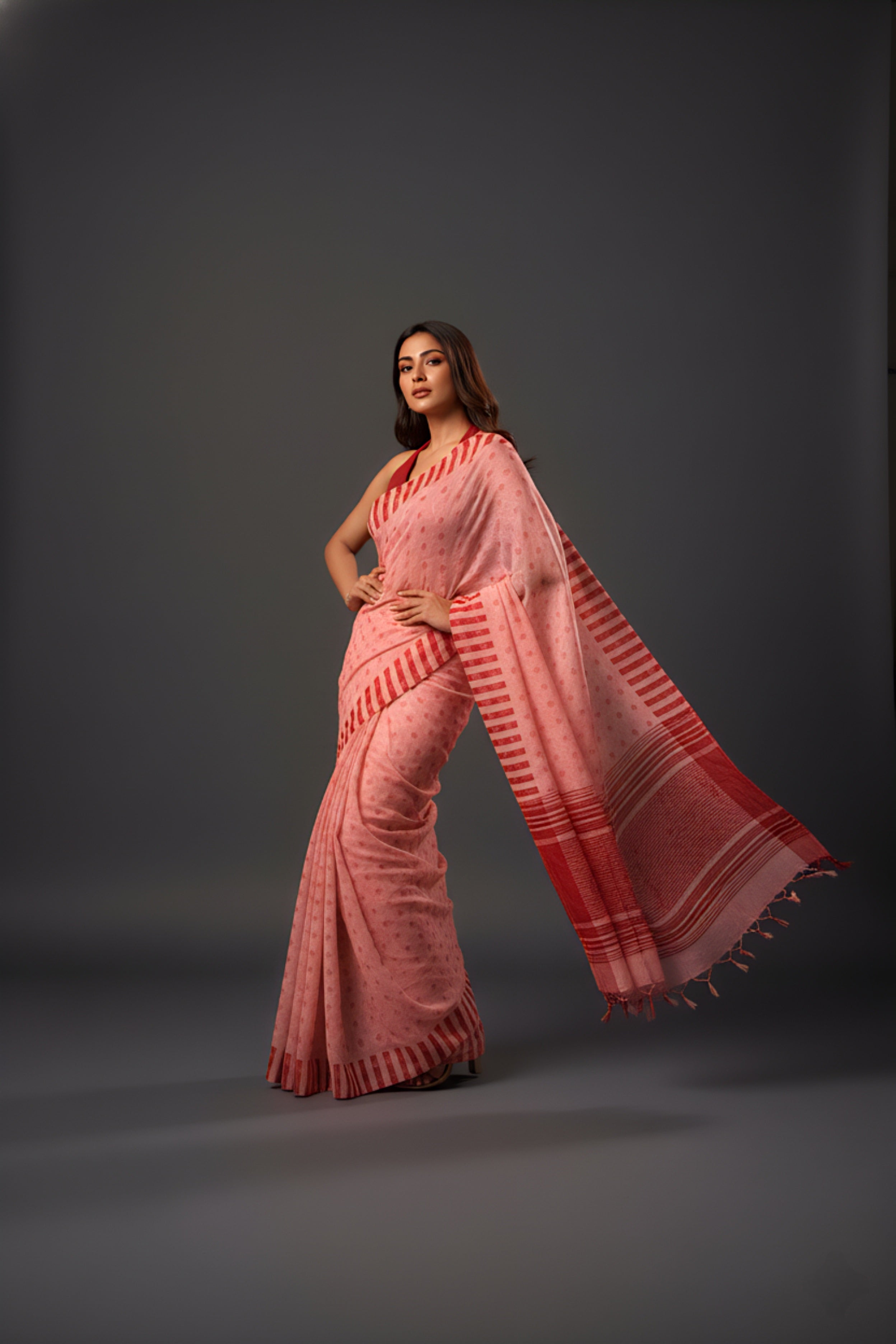 Graceful Red Brasso Saree with Floral Prints & Stylish Striped Edges