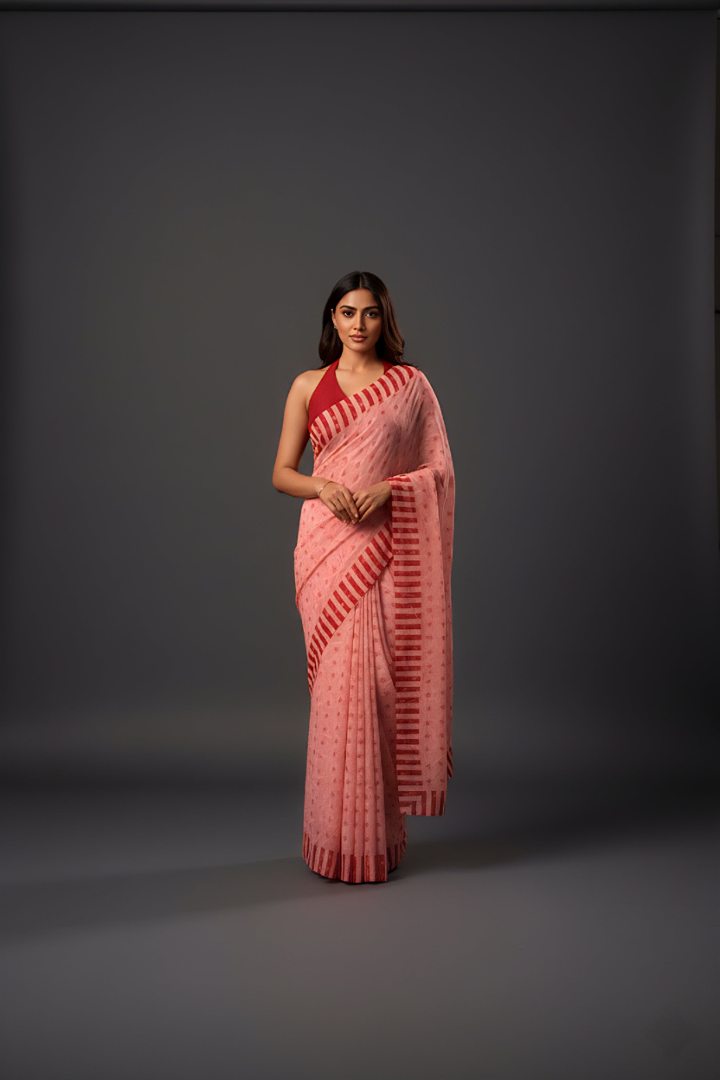 Graceful Red Brasso Saree with Floral Prints & Stylish Striped Edges